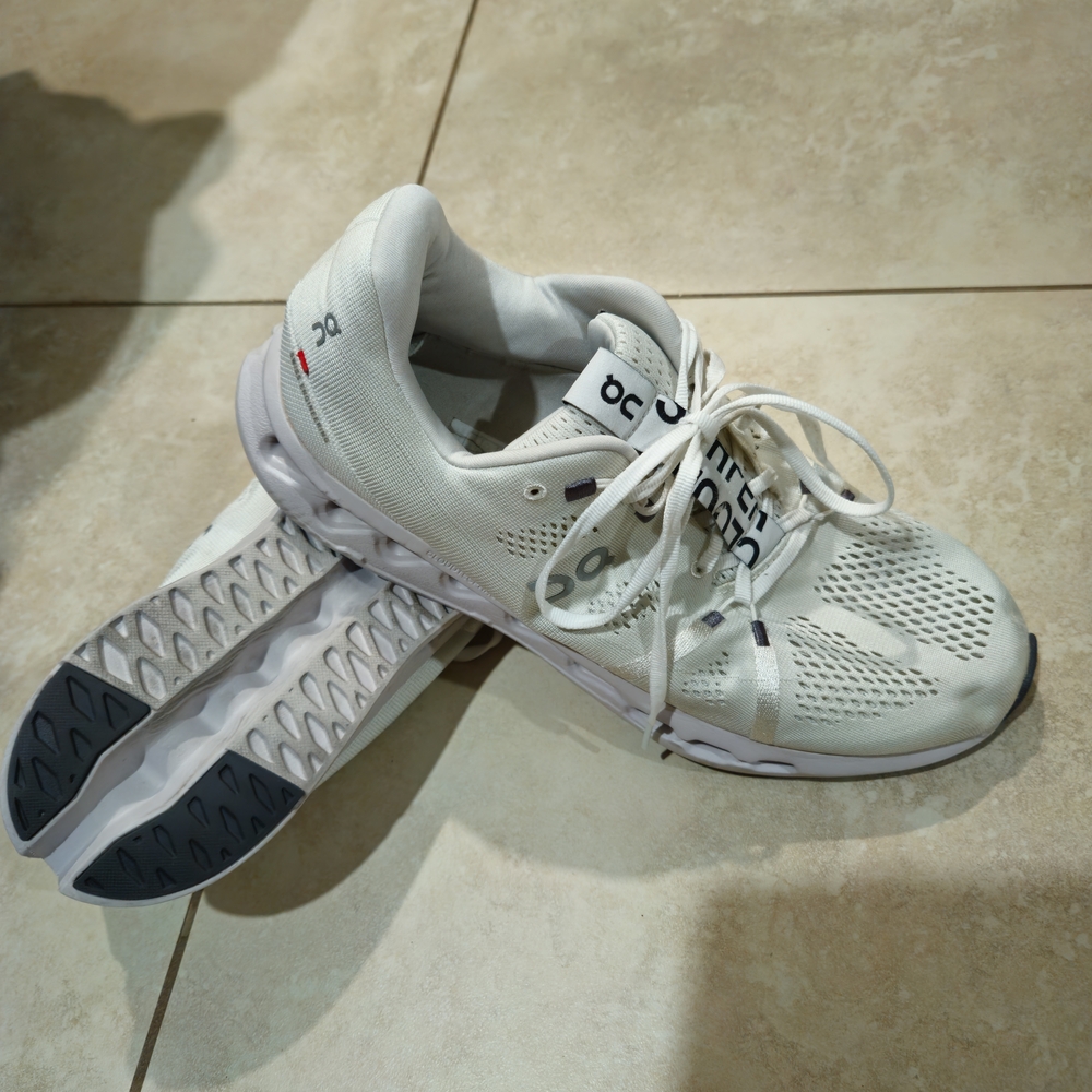 On Running Cream and Gray Sneakers